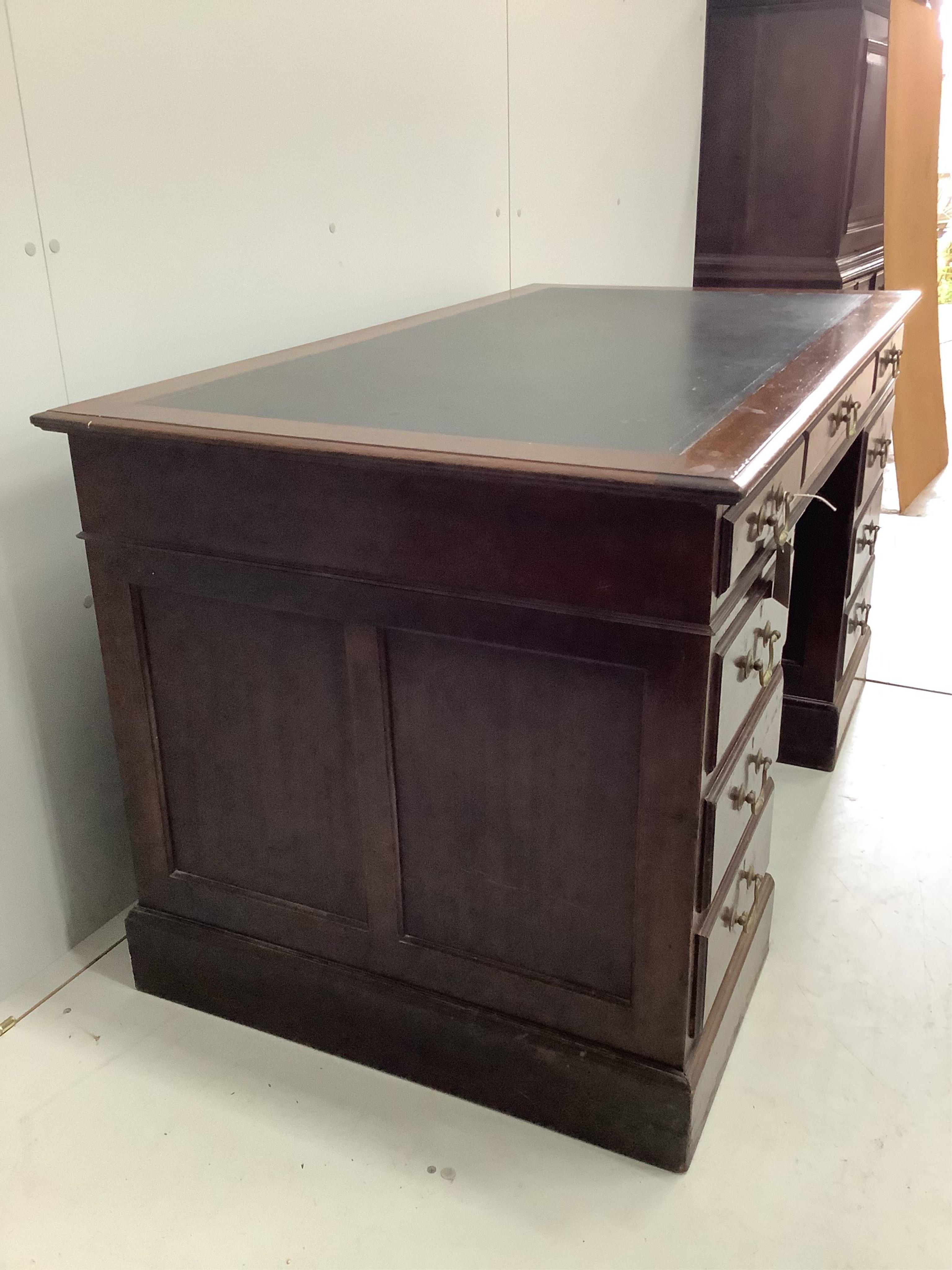 An Edwardian mahogany pedestal desk, width 137cm, depth 76cm, height 77cm. Condition - fair